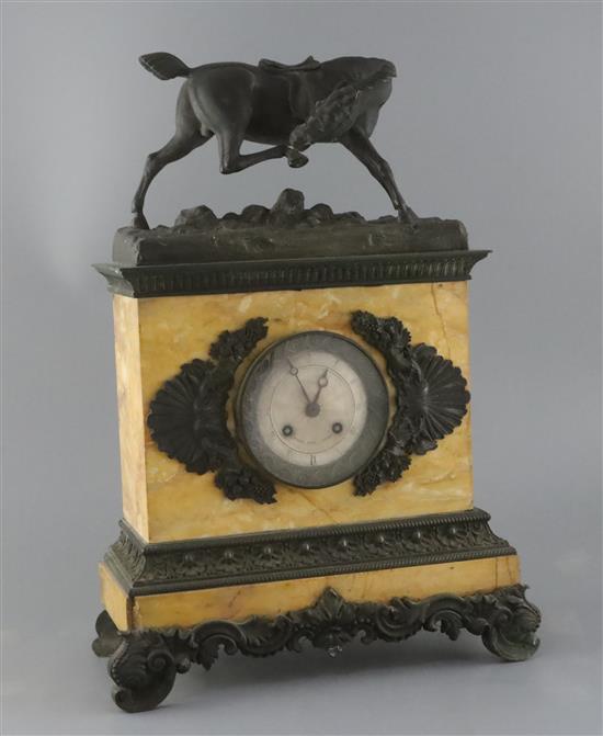A Charles X French bronze and Sienna marble mantel clock, width 12.5in. height 17.25in.